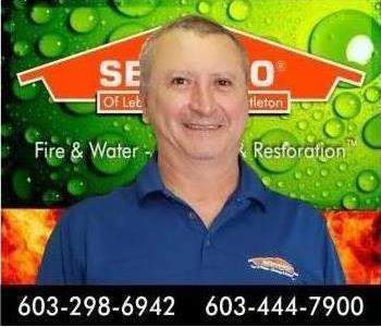 Picture of man with green and orange SERVPRO background