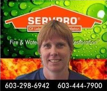 Picture of Woman with green and orange SERVPRO background